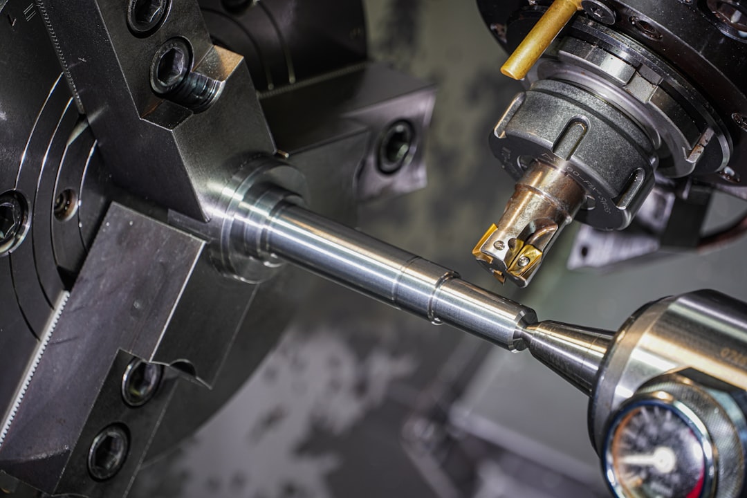 Precision metal component held in a machining fixture